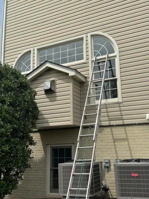 Second-story arched window — replaced from the exterior